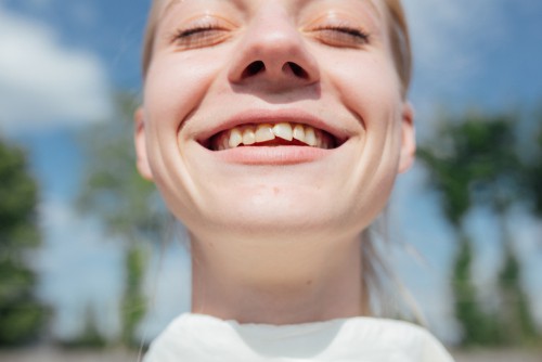 girl smiling with crooked teeth